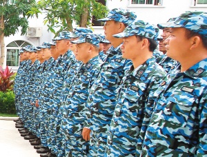 Tanmen Maritime Militia Company personnel wearing blue uniforms in 2014.