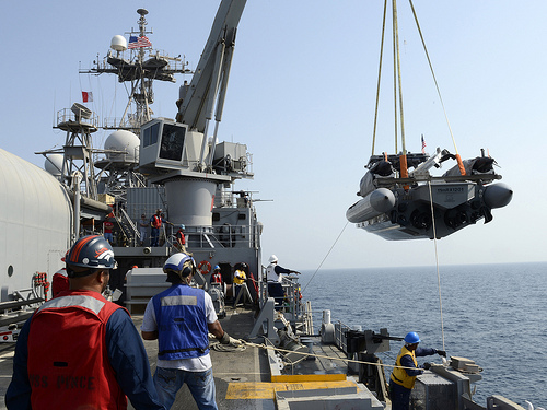 Civilian mariners aboard Afloat Forward Staging Base (Interim) Ship USS Ponce (ASFB(I) 15) lower an 11-meter rigid hull inflatable boat (RHIB) to conduct tests on two M18 Mod 2 Kingfish Unmanned Underwater Vehicles. Ponce, formerly designated as an amphibious transport dock (LPD) ship, was converted and reclassified in April to fulfill a long-standing U.S. Central Command request for an AFSB to be located in its area of responsibility.