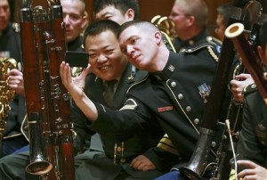 Musicians from the military bands of China's People's Liberation Army and the U.S. Army take photos during a rehearsal for their joint concert in Beijing in this file photo