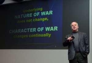 Marine Corps Col. (ret.) T.X. Hammes speaks to USTRANSCOM workers about the evolution of war.