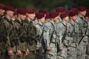 Members of the U.S. Army 173rd Airborne Brigade and a Polish paratrooper unit attend a welcome ceremony | Sean Gallup/Getty Images