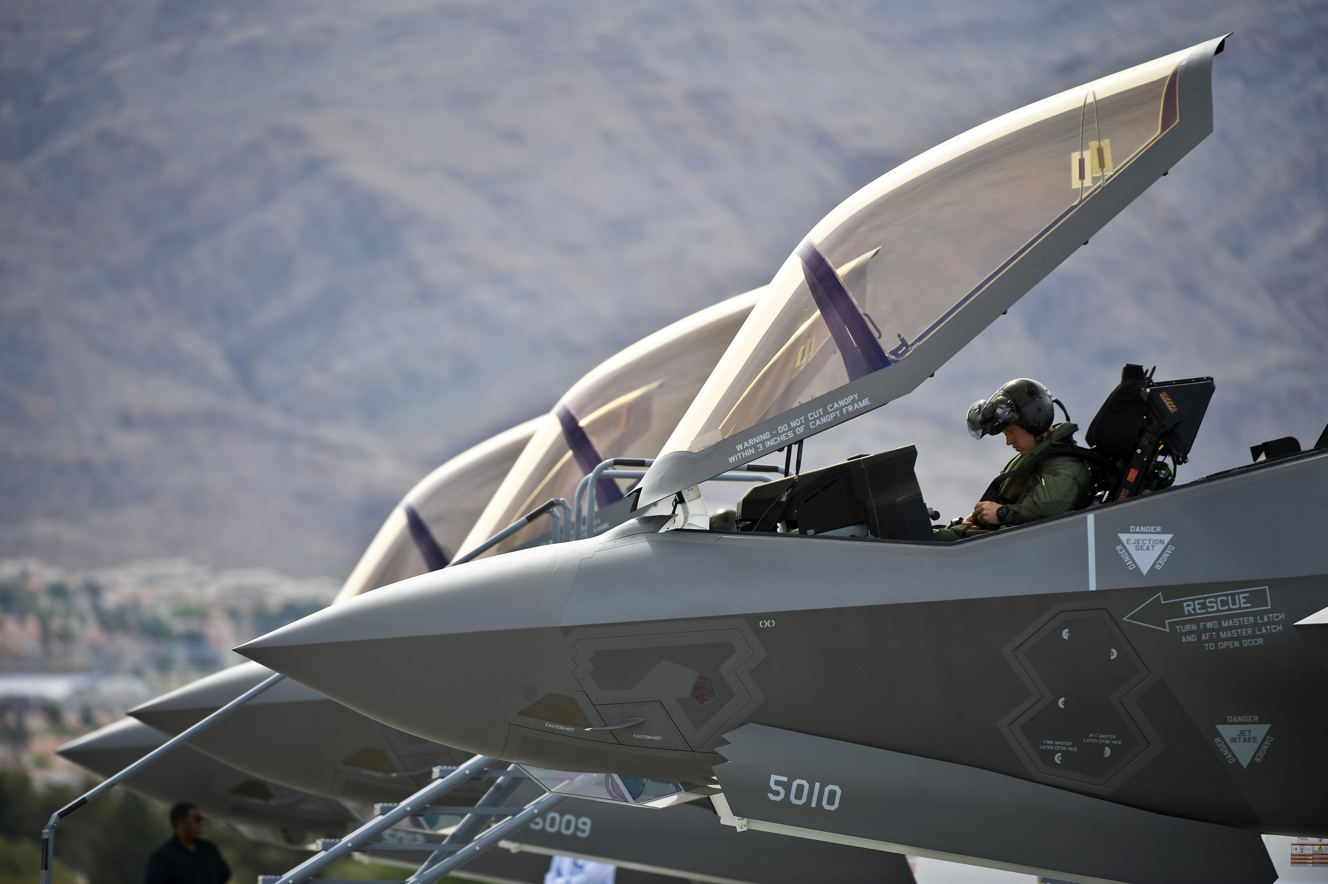 U.S. Air Force Capt. Brad Matherne, a pilot with the 422nd Test and Evaluation Squadron, conducts preflight checks inside an F-35A Lightning II aircraft before its first operational training mission April 4, 2013, at Nellis AFB, NV.