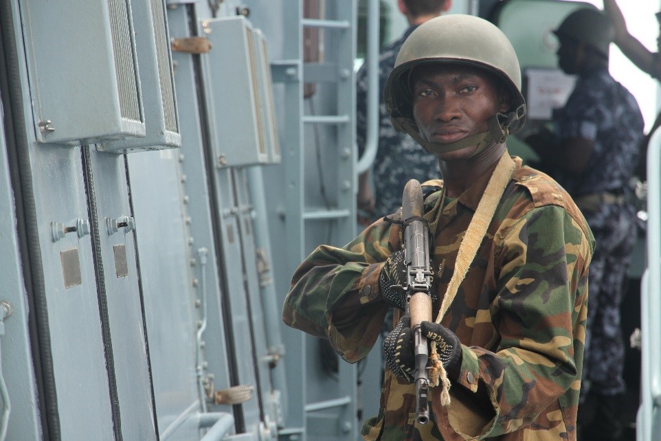 A Togolese soldier provides rearward security for the Togo boarding team on the bridge of the target vessel BRANDENBURG during OBANGAME EXPRESS 2015. (Photo: German Navy/Steve Back)
