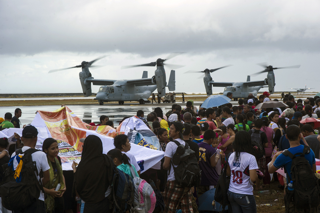 MV-22 Ospreys assigned to the Marine Medium Tiltrotor Squadron 261, 1st Marine Aircraft Wing, take on supplies to provide aid during "Operation Damayan." The George Washington Strike Group supports the 3rd Marine Expeditionary Brigade to assist the Philippine government in response to the aftermath of Super Typhoon Haiyan/Yolanda in the Republic of the Philippines. Image Credit: CC by U.S. Pacific Command/Flickr.