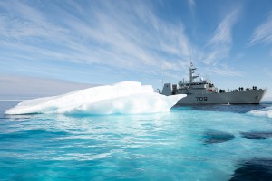 Members of Her Majesty's Canadian Ship SASKATOON carefully maneuver the ship around a large piece of ice while travelling through the Amundsen Gulf on August 22, 2015 during Operation NANOOK. Photo: Cpl Donna McDonald, AETE Imagery Data Systems. ET2015-5751-04