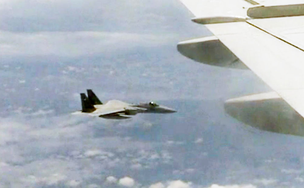 A screenshot from a video posted on the website of China's Ministry of National Defense shows a Japanese fighter jet following Chinese fighter jet. (Handout)