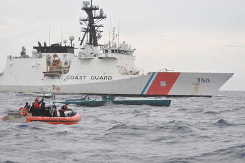 A Coast Guard Cutter Bertholf boarding team aboard an Over the Horizon Long-Range Interceptor boat approaches a self-propelled semi-submersible vessel suspected of smuggling 7.5 tons of cocaine in the Eastern Pacific Ocean, Aug. 31, 2015. The seized contraband is worth an estimated $227 million. (U.S. Coast Guard photo)