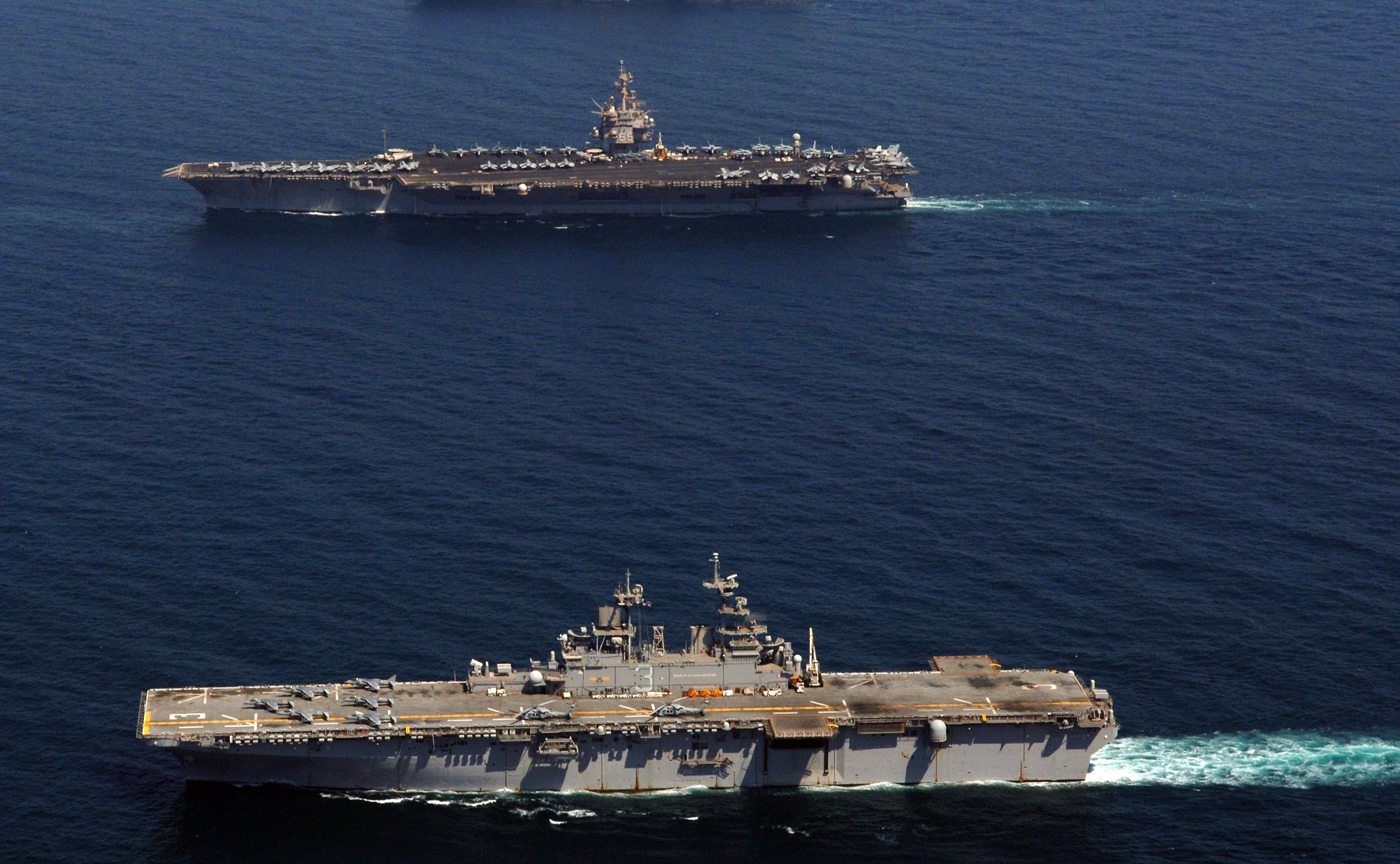 070928-N-5928K-011 PERSIAN GULF (Sept. 28, 2007) - Nuclear-powered aircraft carrier USS Enterprise (CVN 65) and amphibious assault ship USS Kearsarge (LHD 3) and USS Bonhomme Richard (LHD 6) transit alongside each other in the Persian Gulf. Enterprise and embarked Carrier Air Wing (CVW) 1 are underway on a scheduled deployment. U.S. Navy photo by Mass Communication Specialist 3rd Class N.C. Kaylor (RELEASED)