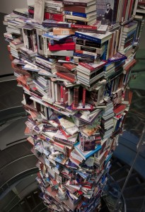 A tower of books about Abraham Lincoln as seen from the top down.