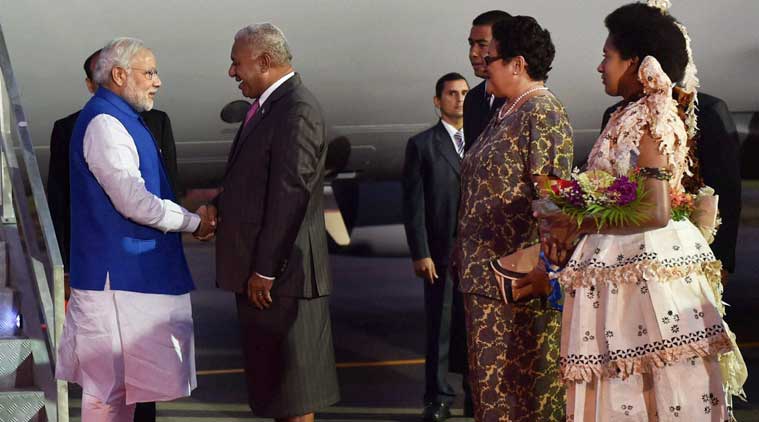 Prime Minister Narendra Modi being welcomed by his Fijian counterpart Josaia Voreqe Bainimarama at Nausori International Airport as he arrives in Fiji on Wednesday. (PTI Photo)