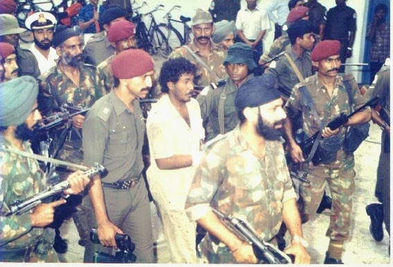 Indian commandos escort the captured leader of the attempted coup in 1988.