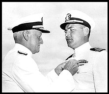 SLUG: ME/Cutter-ob DATE SHOT: 07/27/1944 (Downloaded 06/12/2005 by EEL) CREDIT: AP Photo/U.S. Navy CAPTION:Admiral Chester W. Nimitz pins the Navy Cross on Lt. Cmdr. Slade Cutter, right, for his exploits as a submarine skipper in raids against Japanese shipping on July 27, 1944 at a ceremony in San Francisco. Lt. Cmdr. Cutter of Vallejo and Hollywood, sank 18 Japanese ships, during three successive patrols in enemy-controlled waters. Cutter was also awarded two gold stars in lieu of second and third Navy Crosses.