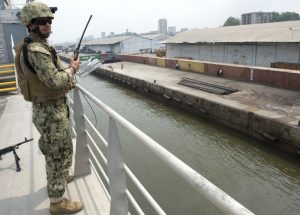 A member of the CRF provide embarked security to USNS SPEARHEAD as it gets underway from Cameroon in February 2016. Credit: MC1 Amanda Dunford, USN