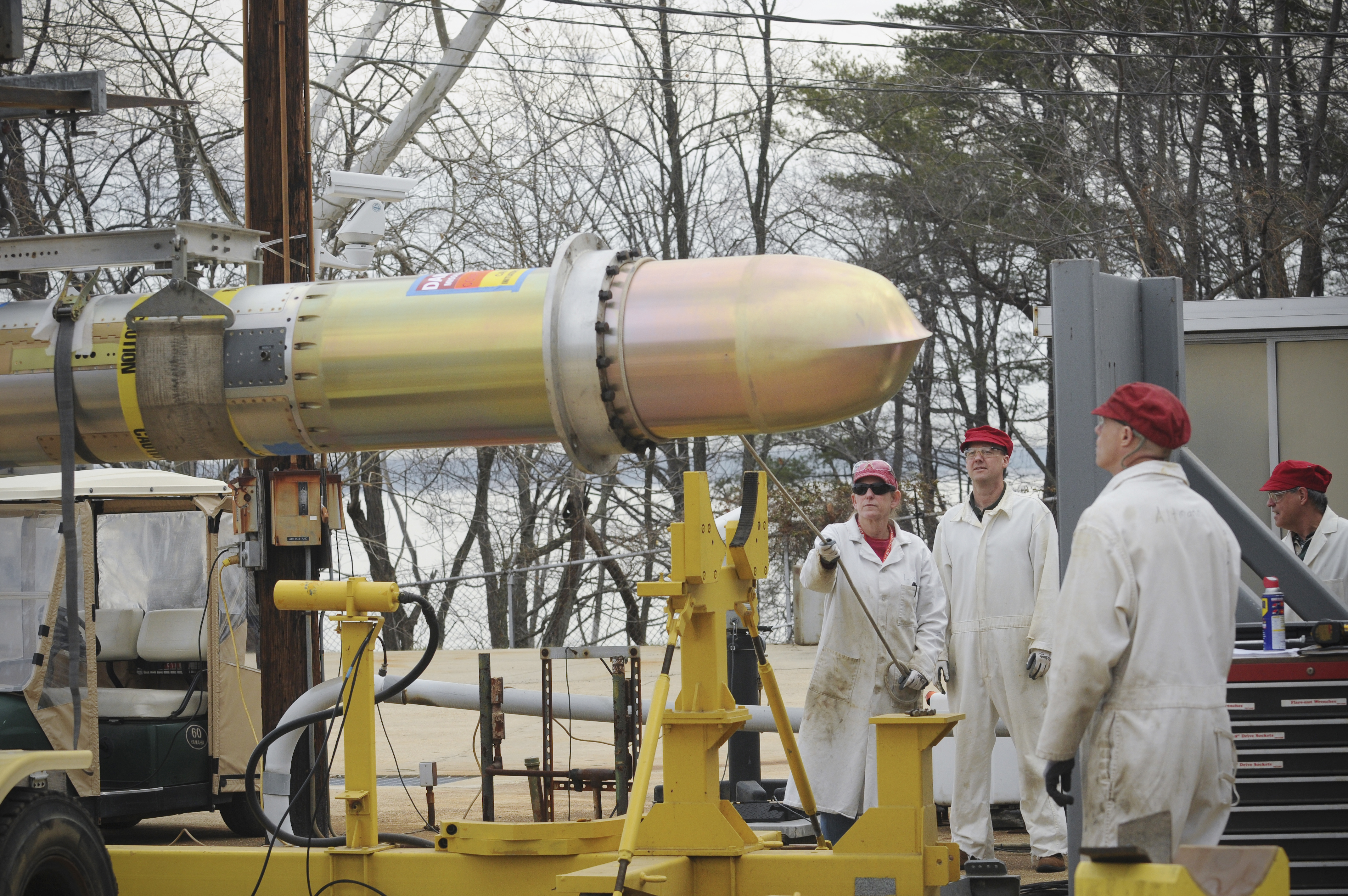 150317-N-MF696-071 INDIAN HEAD, Md. (March 17, 2015) Members of the Explosive Ordnance Disposal Technology Division team at Naval Surface Warfare Center, Indian Head prepare a Tomahawk missile for a functional ground test at the Large Motor Test Facility in Indian Head, Md. The event marks the 84th functional ground test the Division has conducted since the program began 25 years ago. (U.S. Navy photo by Monica McCoy/Released)