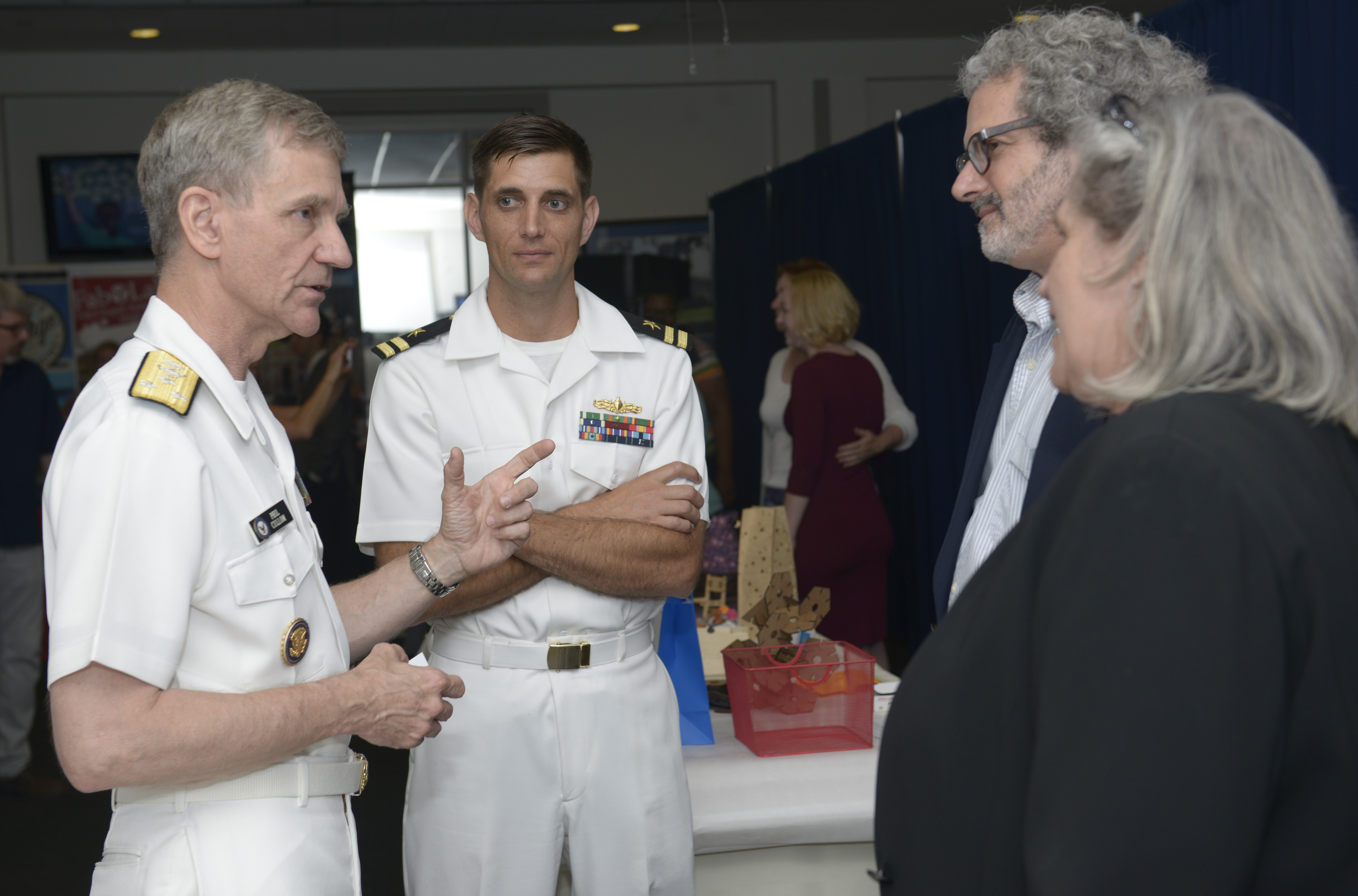 160621-N-YO707-178 Washington, D.C. (June 21, 2016) U.S. Navy Vice Adm. Philip Cullom, deputy CNO for fleet readiness and logistics, speaks with Prof. Neil Gershenfeld, second from right, director of MIT's Center for Bits and Atoms during the Capitol Hill Maker Faire in Washington, D.C., June 21, 2016. The Faire showcased robotics, drones, 3D printing and printed art. (U.S. Navy photo by Mass Communication Specialist 2nd Class Cyrus Roson/ Released)