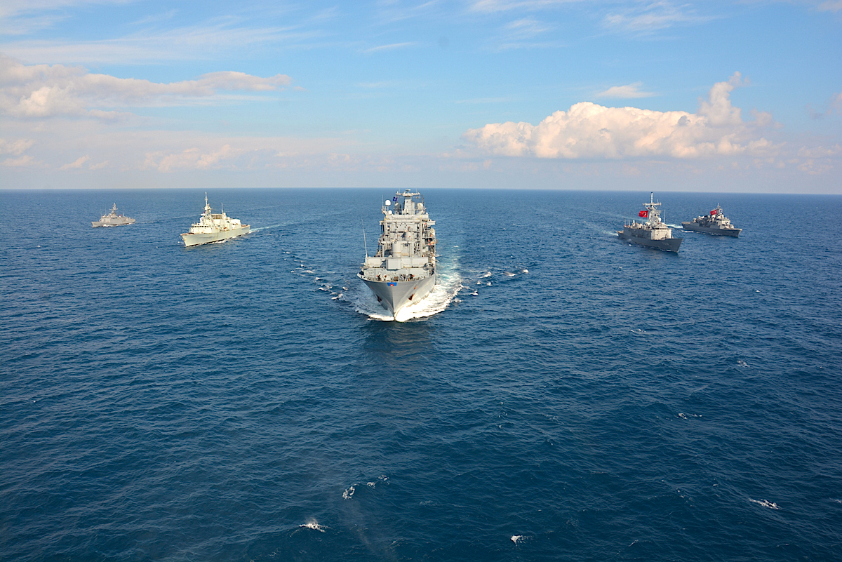 Standing NATO Maritime Group 2, seen here steaming in formation, is currently tasked with operating on the Aegan Sea refugee route. (NATO)