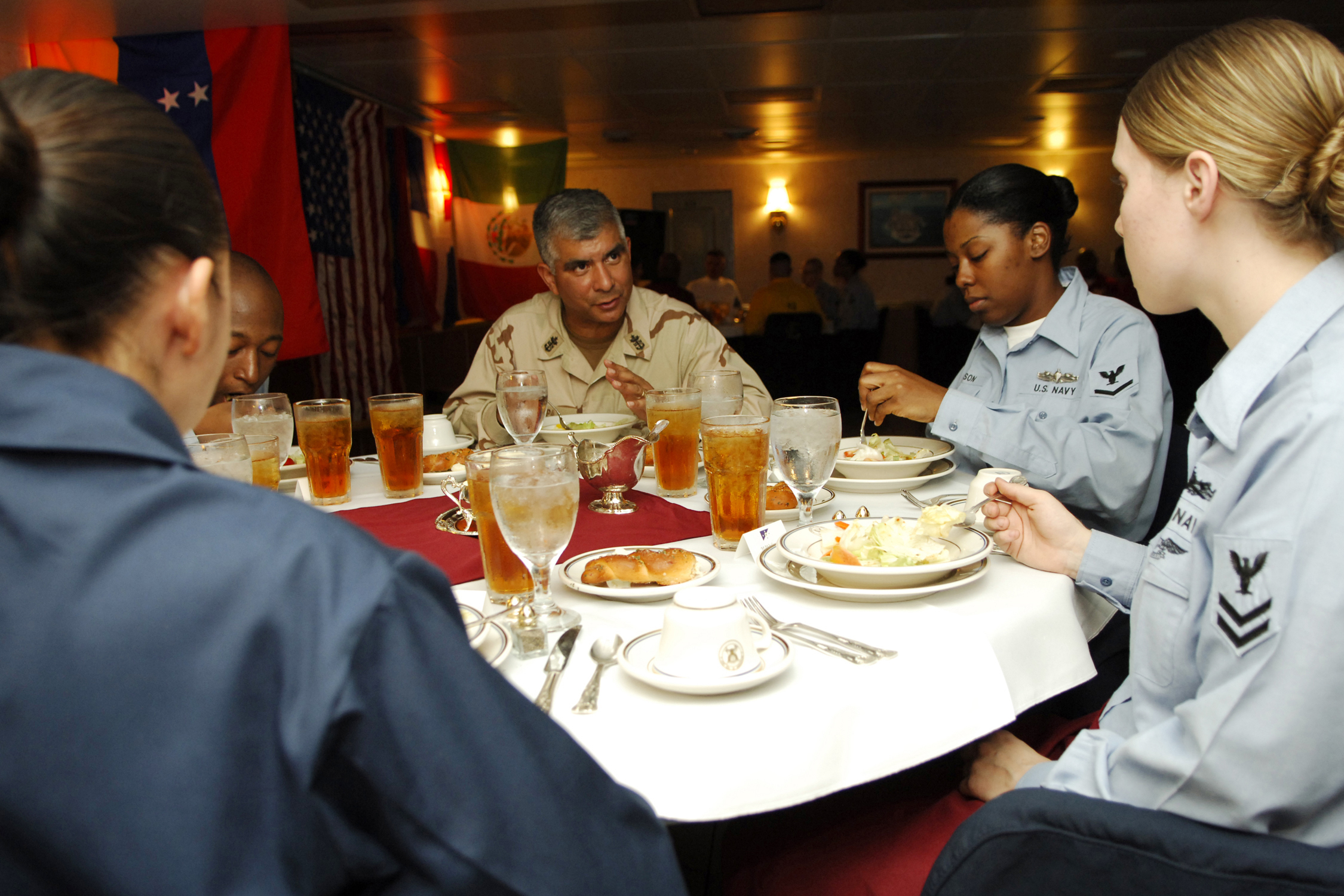 071029-N-1598C-028 PERSIAN GULF (Oct. 29, 2007) - Master Chief Petty Officer of the Navy (MCPON) Joe R. Campa Jr. enjoys a formal dinner in the wardroom with junior Sailors aboard nuclear-powered aircraft carrier USS Enterprise (CVN 65). MCPON and Chief of Naval Operations (CNO) Adm. Gary Roughead are visiting Sailors in the 5th Fleet area of responsibility. Enterprise and embarked Carrier Air Wing (CVW) 1 are underway on a scheduled deployment. U.S. Navy photo by Mass Communication Specialist 3rd Class McKinley Cartwright (RELEASED)