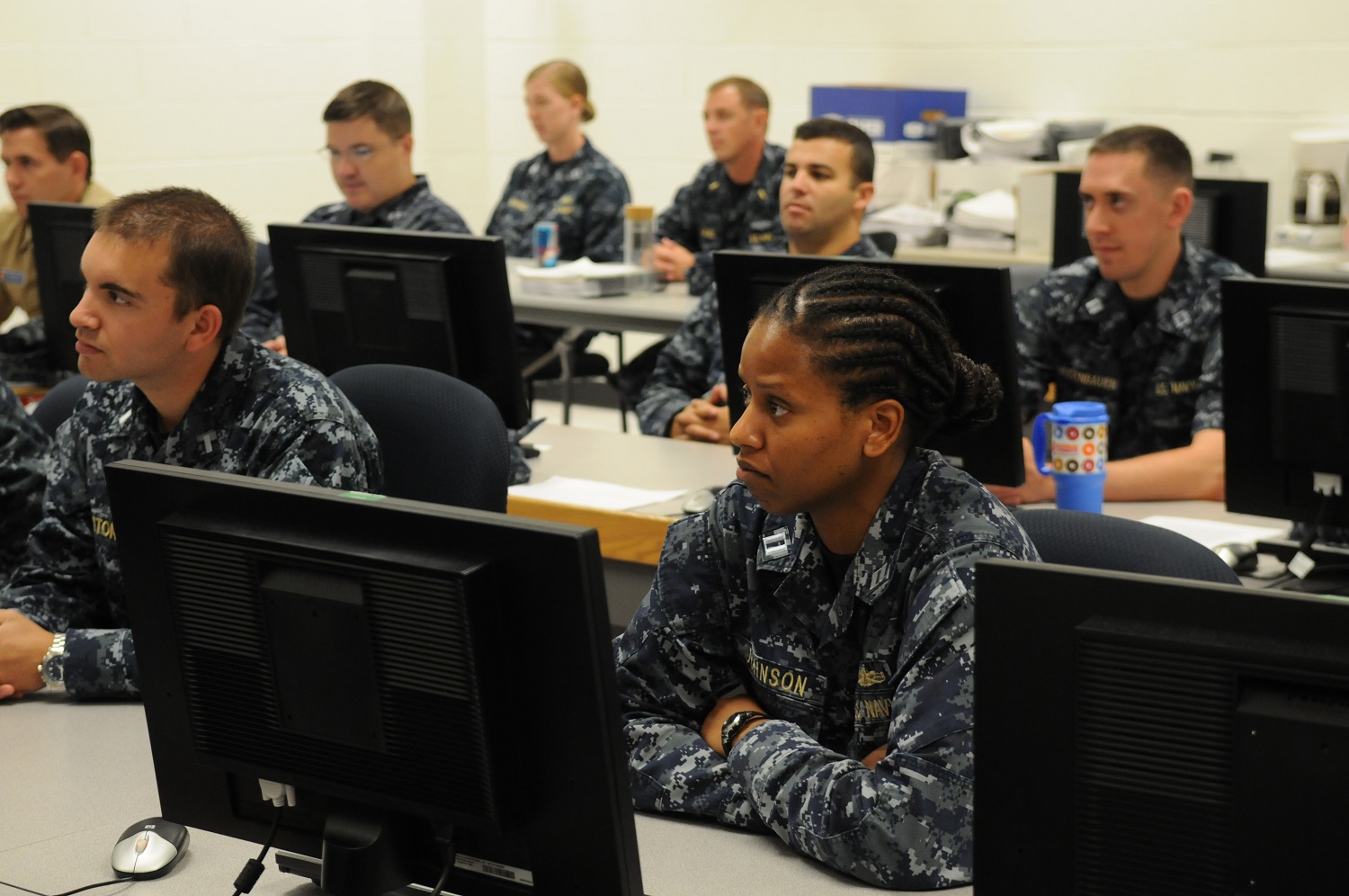 150828-N-PU674-005 PENSACOLA, Fla. (Aug. 28, 2015) Officers attending the Information Professional Basic Course at Center for Information Dominance Unit Corry Station listen to Rear Adm. Daniel J. MacDonnell, commander of Information Dominance Corps Reserve Command (IDCRC) and Reserve deputy commander of Navy Information Dominance Forces (NAVIDFOR). Macdonnell spoke with them about career opportunities in the Information Dominance Corps and active and reserve integration. (U.S. Navy photo by Carla M. McCarthy/Released)