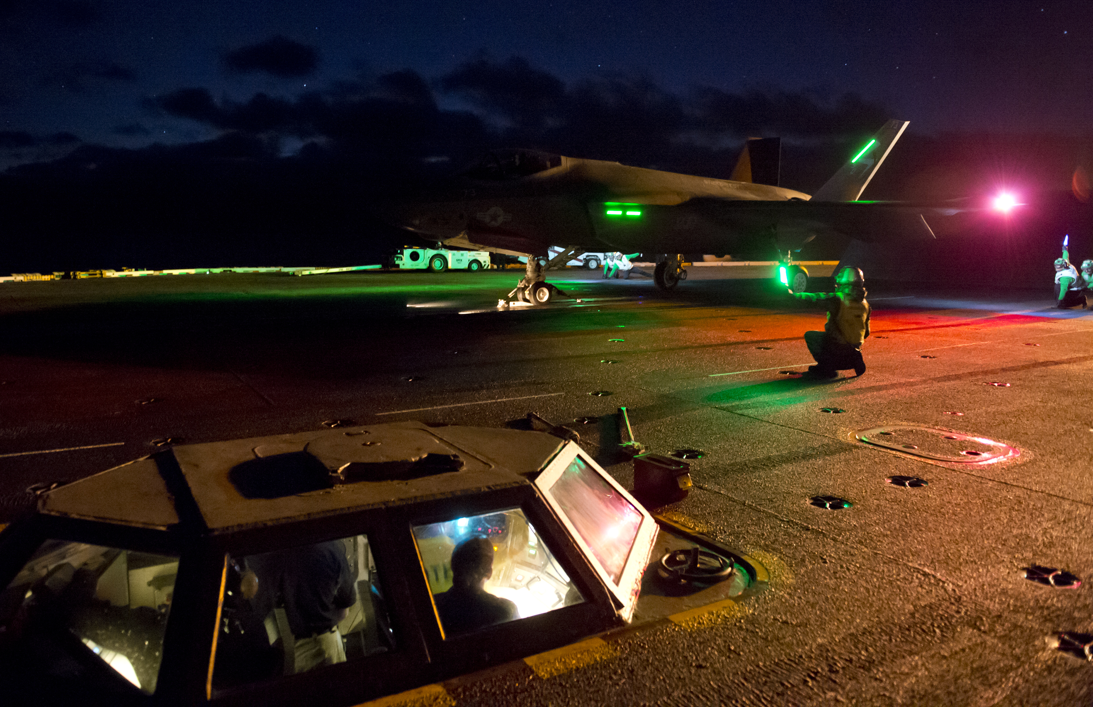 141113-O-ZZ999-001 PACIFIC OCEAN (Nov. 13, 2014) An F-35C Lightning II carrier variant Joint Strike Fighter conducts its first carrier-based night flight operations aboard the aircraft carrier USS Nimitz (CVN 68). The aircraft launched at 6:01 p.m. (PST) and conducted a series of planned touch-and-go landings before making an arrested landing at 6:40 pm. Nimitz is hosting the F-35 Lightning II Pax River Integrated Test Force from Air Test and Evaluation Squadron (VX) 23 during the initial sea trials of the F-35C.(U.S. Navy photo courtesy of Lockheed Martin by Andy Wolfe/Released)