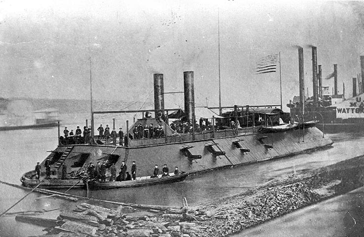 USS Cairo 1862 Photographed in the Mississippi River area during 1862, with a boat alongside her port bow, crewmen on deck and other river steamers in the background. (U.S. Naval Historical Center)