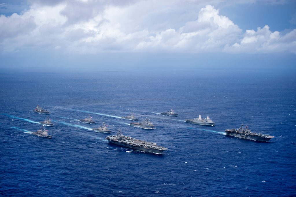 160920-N-NT265-725 PHILIPPINE SEA (Sept. 23, 2016) USS Ronald Reagan (CVN 76) and USS Bonhomme Richard (LHD 6) lead a formation of Carrier Strike Group Five and Expeditionary Strike Group Seven ships including, USS Momsen (DDG 92), USS Chancellorsville (CG 62), USS Stethem (DDG 63), USS Benfold (DDG 65), USS Curtis Wilbur (DDG 54), USS Germantown (LSD 42), USS Barry (DDG 52), USS Green Bay (LPD 20), USS McCampbell (DDG 85), as wells as USNS Walter S. Diehl (T-AO 193) during a photo exercise to signify the completion of Valiant Shield 2016. Valiant Shield is a biennial, U.S. only, field-training exercise with a focus on integration of joint training among U.S. forces. This is the sixth exercise in the Valiant Shield series that began in 2006. (U.S. Navy photo by Mass Communication Specialist 2nd Class Christian Senyk/Released)