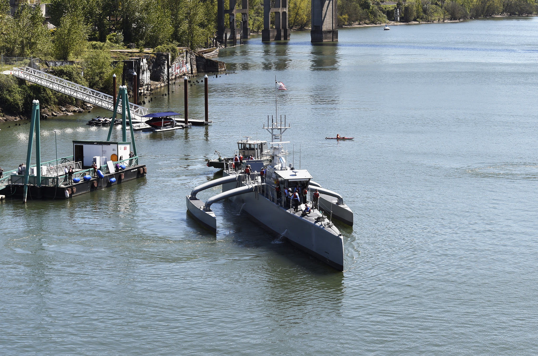 Sea Hunter, an entirely new class of unmanned ocean-going vessel gets underway on the Williammette River following a christening ceremony in Portland, Oregon. (U.S. Navy photo by John F. Williams/Released)