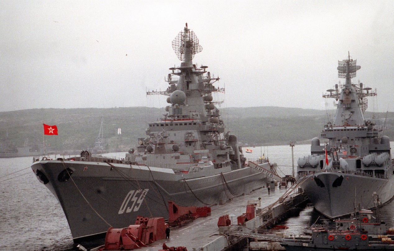Figure 3: the Kirov class cruiser that used to be called the Kirov, but in 1992 when this photo was taken had its name changed to Ushakov, alongside a Slava class cruiser which had also been renamed from the Admiral Flota Lobov to Marshal Ustinov. Source: CWO2 Tony Alleyne via Wikimedia Commons.42