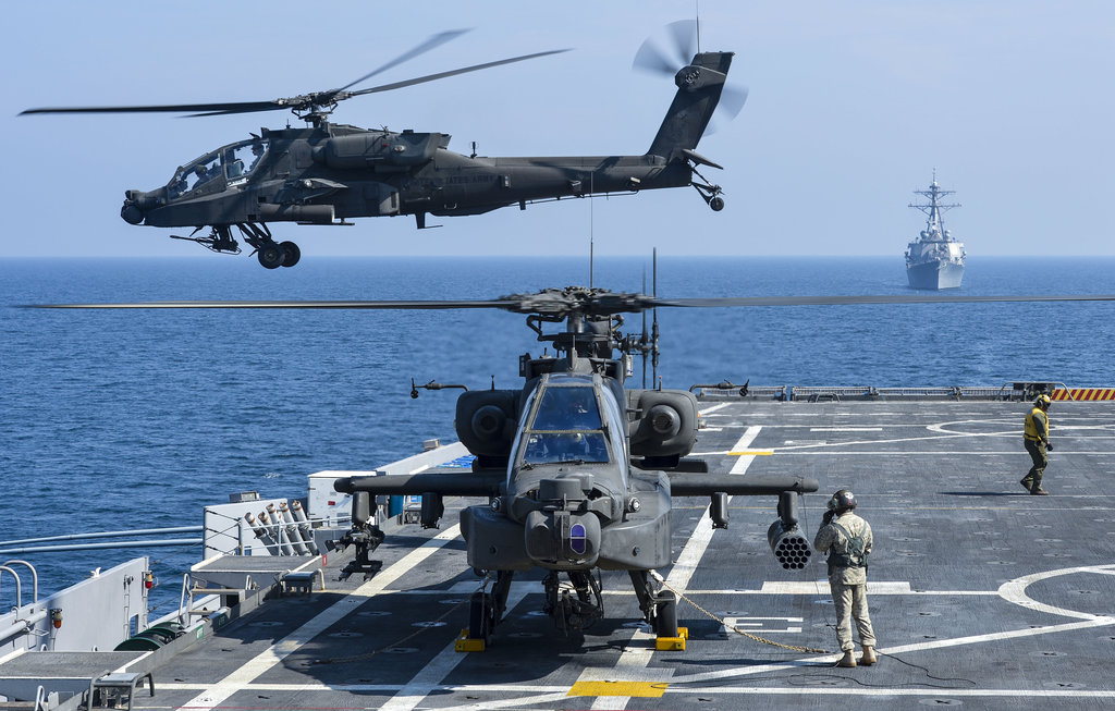 A U.S. Army AH-64D Apache helicopter takes off from Afloat Forward Staging Base (Interim) USS Ponce (AFSB(I) 15), during an exercise. Ponce, formerly designated as an amphibious transport dock ship, was converted and reclassified to fulfill a long-standing U.S. Central Command request for an AFSB to be located in the U.S. 5th Fleet area of responsibility. (U.S. Navy photo by Mass Communication Specialist 1st Class Jon Rasmussen/Released)