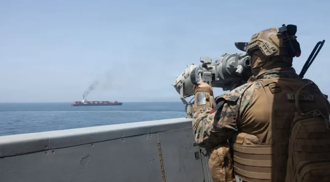 In this handout photo provided by U.S. Central Command, U.S. forces patrol the Arabian Sea near M/V Touska on April 20, 2026, after firing upon the Iranian-flagged vessel that the U.S. accused of attempting to violate the U.S. naval blockade of Iranian ports near the Strait of Hormuz