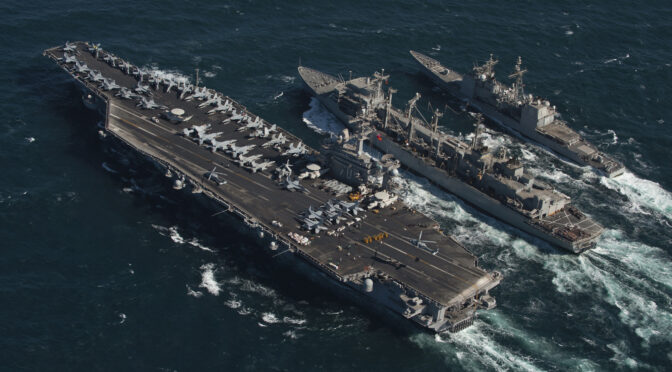 The Nimitz-class aircraft carrier USS Carl Vinson (CVN 70) and the Ticonderoga-class guided missile cruiser USS Bunker Hill (CG 52) conduct a replenishment at sea with the Military Sealift Command fast combat support ship USNS Bridge (T-AOE 10). Carl Vinson and Carrier Air Wing (CVW) 17 are deployed to the U.S. 5th Fleet area of responsibility.