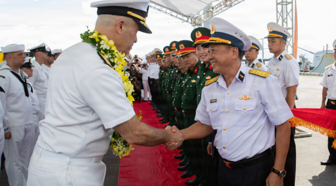 Rear Adm. Eric Anduze, commander, Task Force 70 and Carrier Strike Group 5, shakes hands with a member of the Vietnamese military during Nimitz-class aircraft carrier USS George Washington’s (CVN 73) regularly scheduled port visit in Da Nang, Vietnam, July 30, 2026. George Washington is the U.S. Navy’s premier forward-deployed aircraft carrier, a long-standing symbol of the United States’ commitment to maintaining a free and open Indo-Pacific, while operating alongside allies and partners across the U.S. Navy’s largest numbered fleet. (U.S. Navy photo by Mass Communication Specialist Seaman Anthony Vilardi)