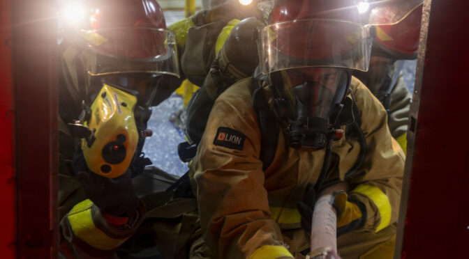 PACIFIC OCEAN (June 25, 2026) – Sailors, assigned to the Emory S. Land Class submarine tender USS Frank Cable (AS 40), fight a simulated fire during a general quarters drill, June 25, 2026. Frank Cable, forward deployed to the island of Guam, repairs, rearms, and resupplies submarines and surface vessels in the Pacific region. (U.S. Navy photo by Mass Communication Specialist Seaman Apprentice William Lawson)