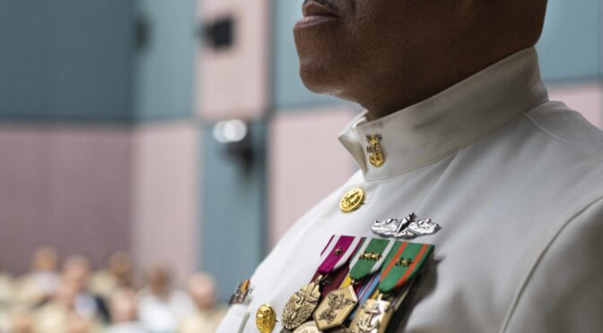 Fleet Master Chief Petty Officer Raymond D. Kemp, fleet master chief for U.S. Naval Forces Europe-Africa, waits to receive the American flag during the reading of “Old Glory” at his retirement ceremony on Naval Support Activity Naples, Italy, June 4, 2019. U.S. 6th Fleet, headquartered in Naples, Italy, conducts the full spectrum of joint and naval operations, often in concert with allied and interagency partners, in order to advance U.S. national interests and security and stability in Europe and Africa. (U.S. Navy photo by Mass Communication Specialist 3rd Class Damon Grosvenor/Released)
