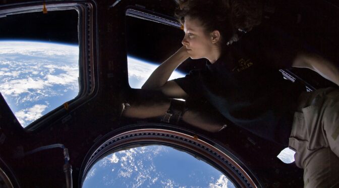Tracy Caldwell Dyson in the Cupola module of the International Space Station observing the Earth below during Expedition 24.
